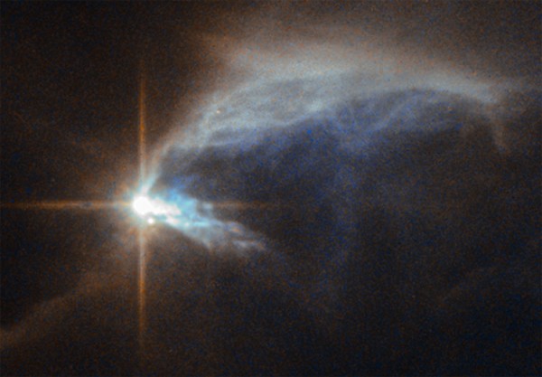 Звезда HBC 1 и отражательная туманность IRAS 00044+6521
