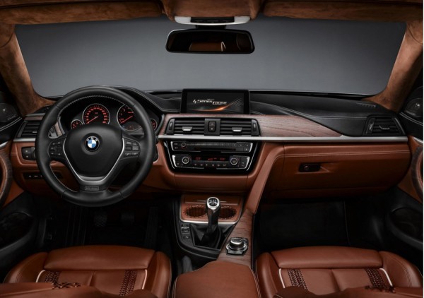 Интерьер четверки BMW целом копирует третью серию
