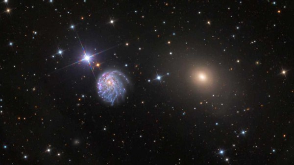 Галактика NGC 2276 вместе с ее меньшим соседом NGC 2300, которая оказывает гравитационную силу на одной стороне NGC 2276 и вызывает ее асимметричную форму