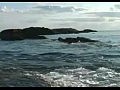 Ocean Waves Crashing over a rock